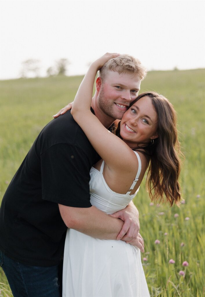Cute picture of the newly engaged, couple hugging