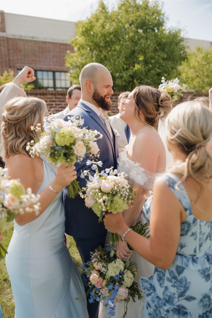 picture of the bride and groom with their bridal parties