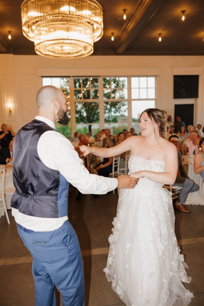 cute picture of the newly married couple dancing at their dream wedding reception