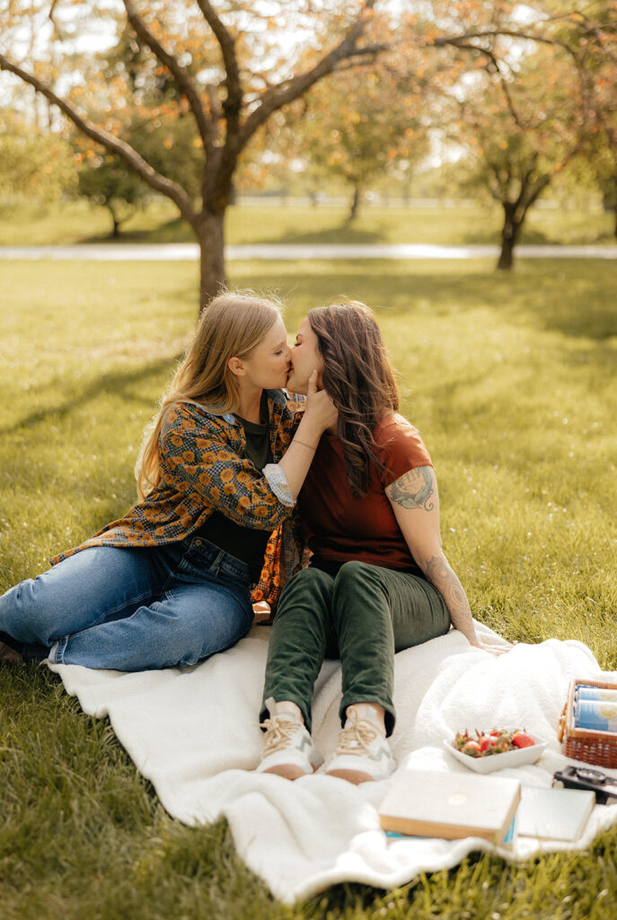 newly engaged couple kissing during their photoshoot