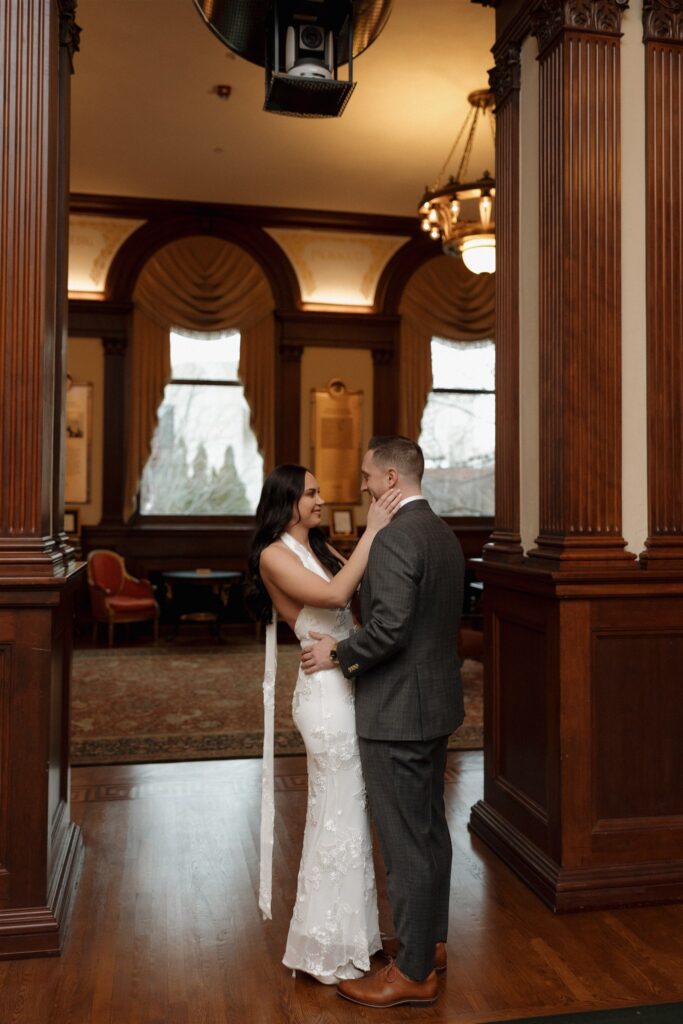 cute picture of the newly engaged couple smiling at each other