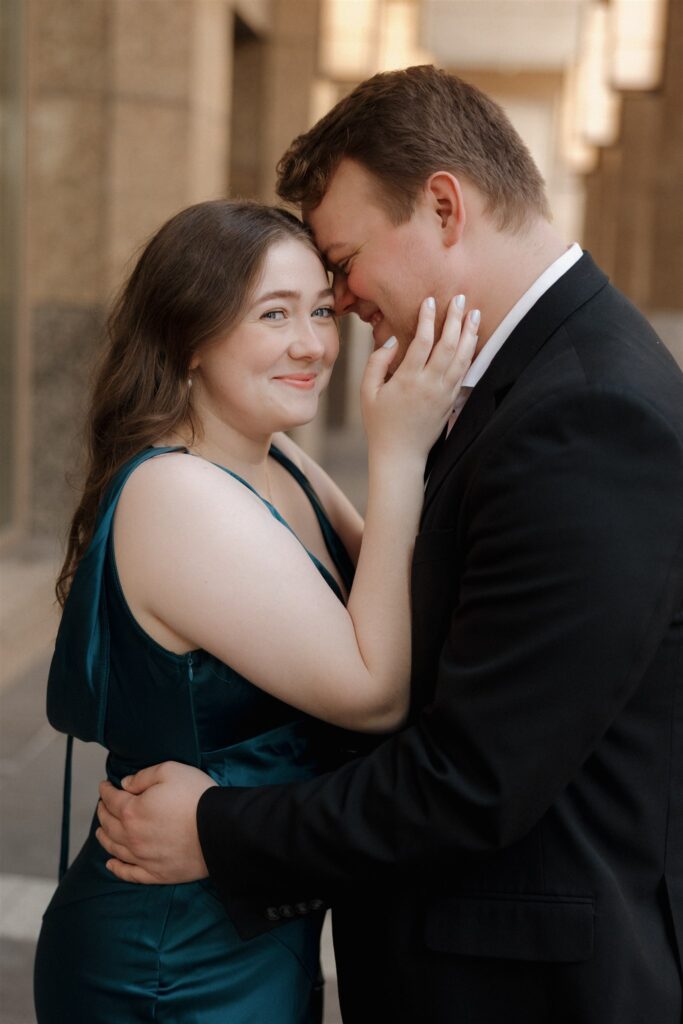 fiance kissing his fiance on the cheek
