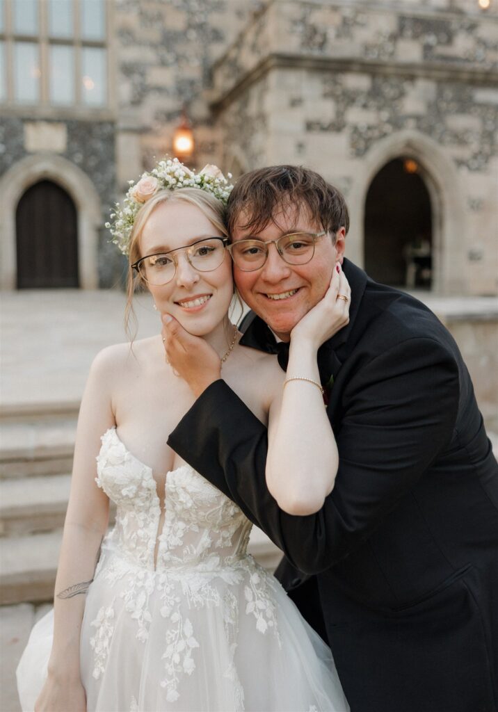 newlyweds smiling at the camera during their bridal session