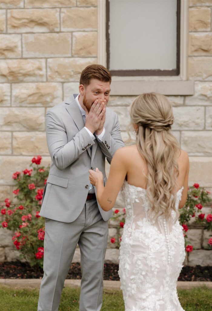 Groom emotional, seeing the bride in her wedding dress