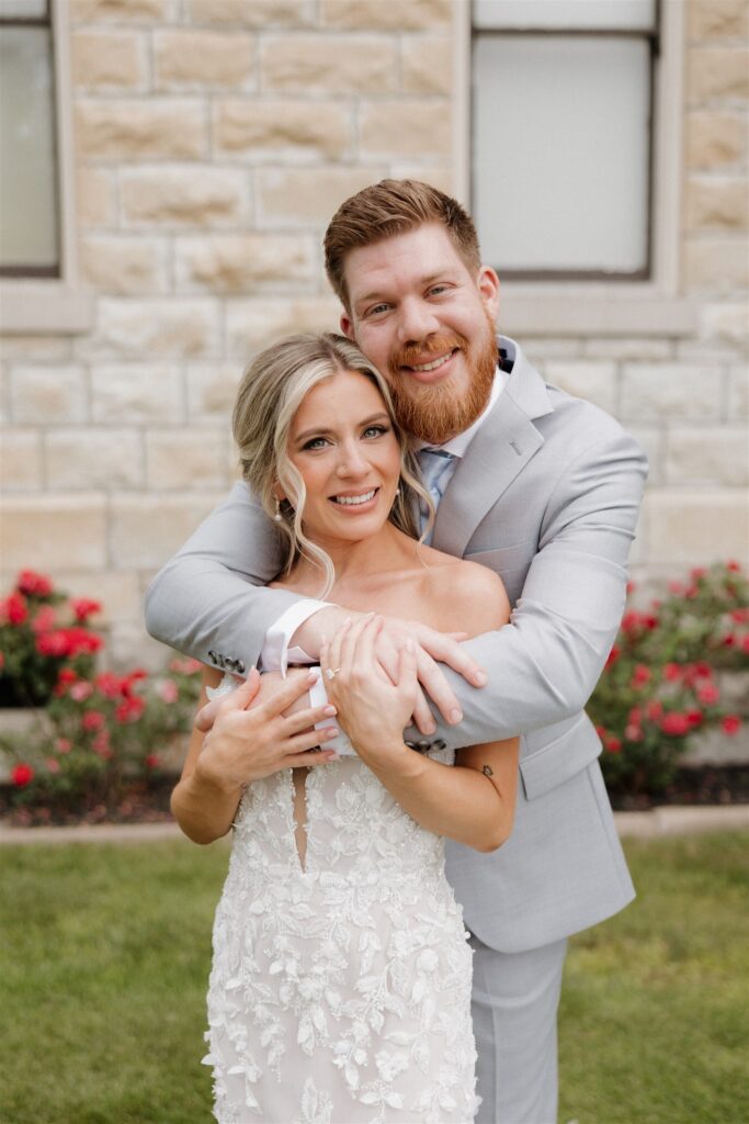 Cute picture of the bride and groom hugging