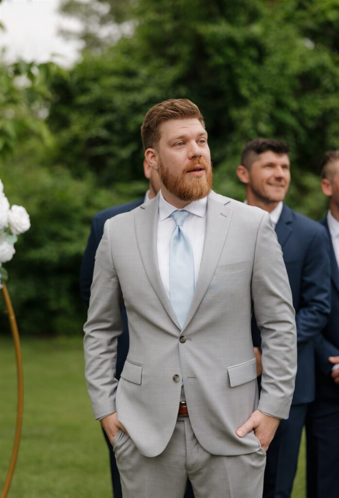 Groom, watching the bride walk down the aisle