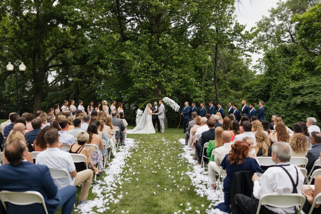 bride and groom, holding hands during their wedding ceremony