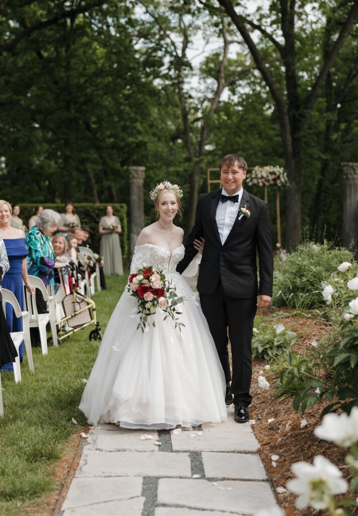 cute picture of the newlyweds heading to their wedding reception