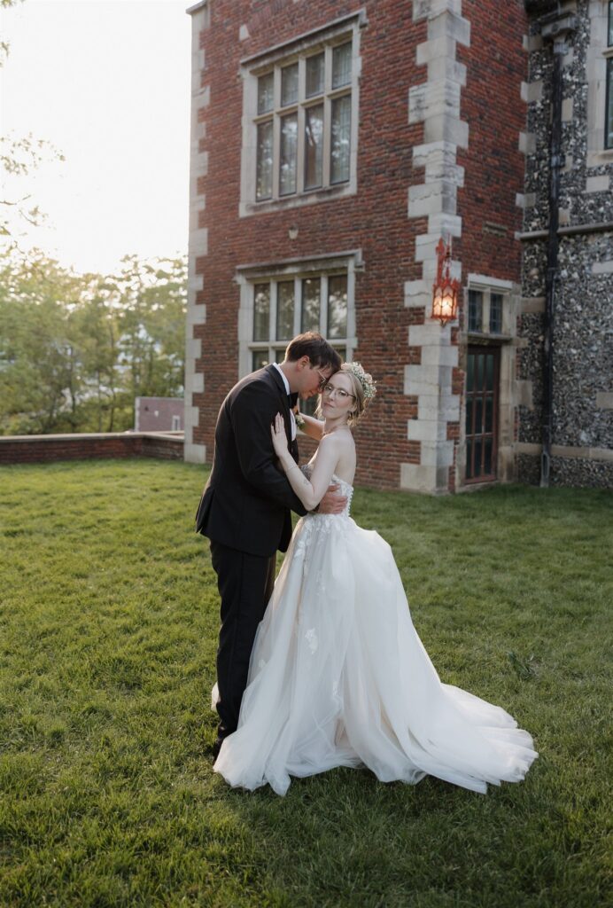 groom kissing the bride on the forehead