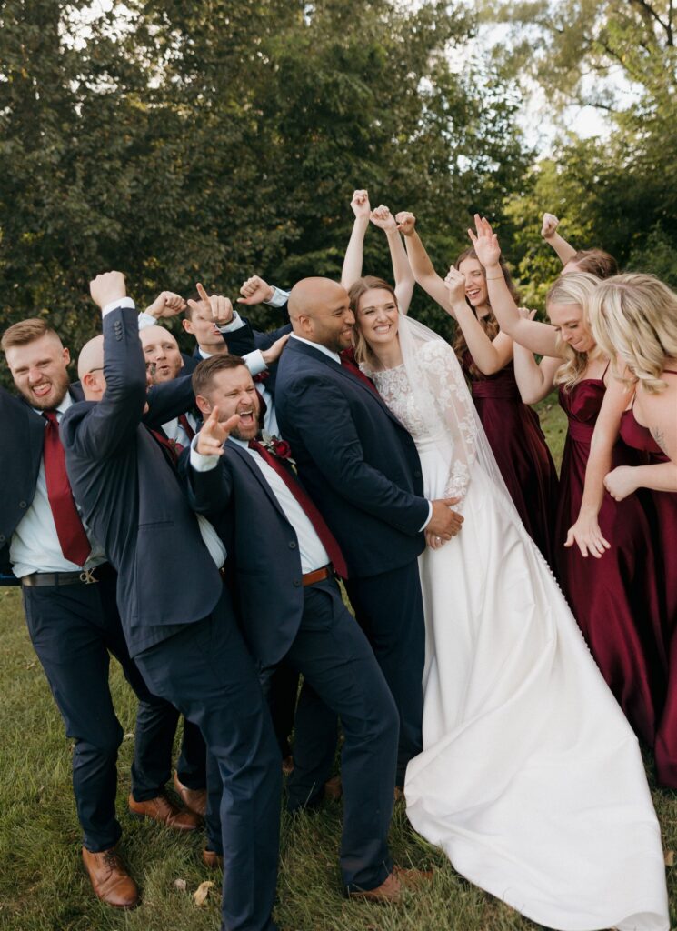 cute picture of the bride and groom and their bridal parties