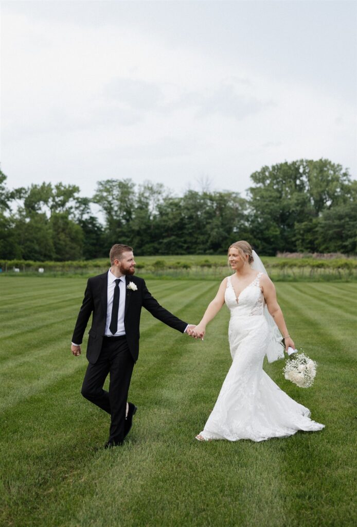 cute picture of the bride and groom holding hands