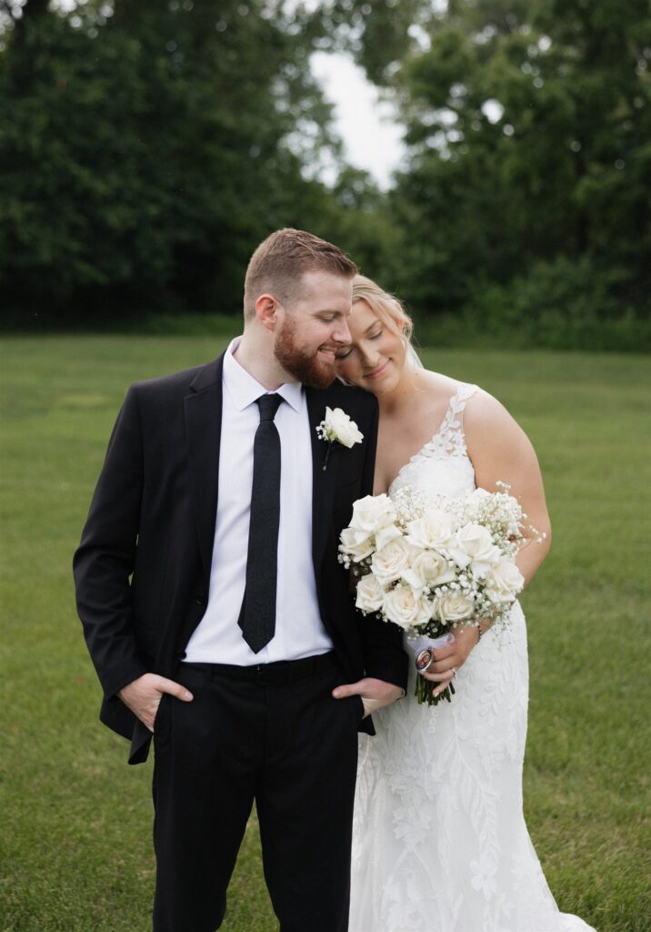 groom kissing the bride on the forehead