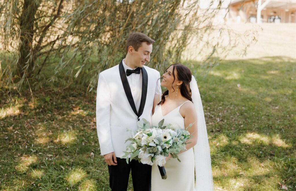 Cute picture of the bride and groom smiling at each other