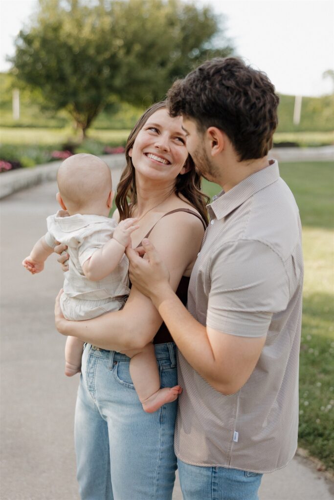 couple smiling at each other during their photoshoot