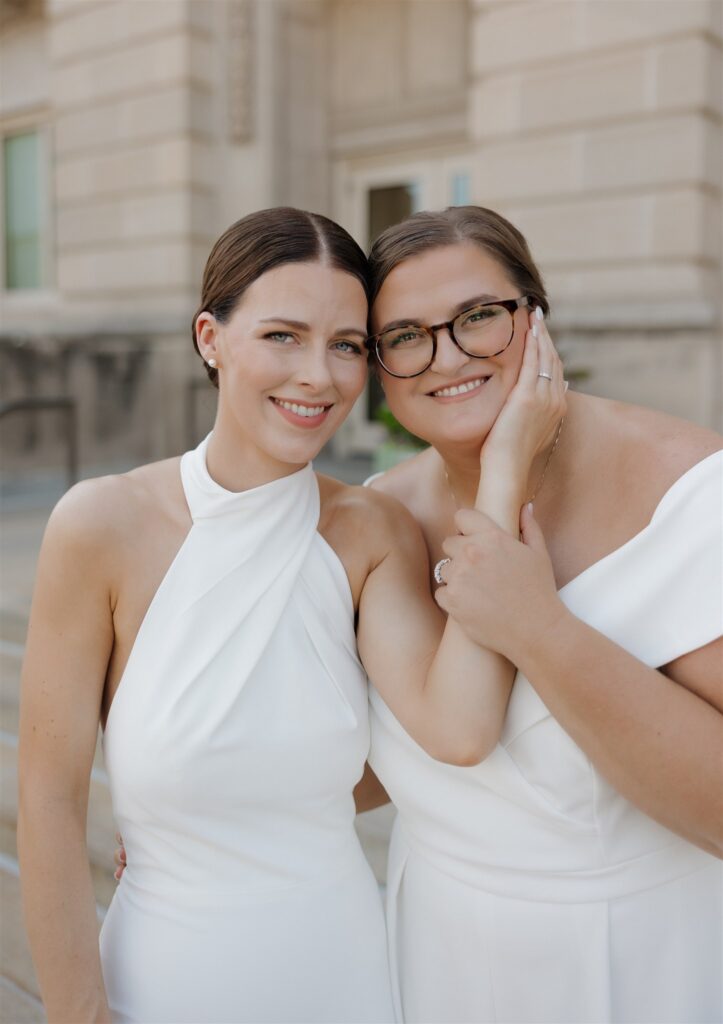couple smiling at the camera during their photoshoot