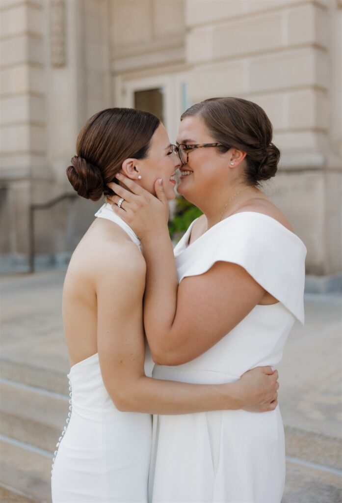 newlyweds smiling at the camera during their photoshoot