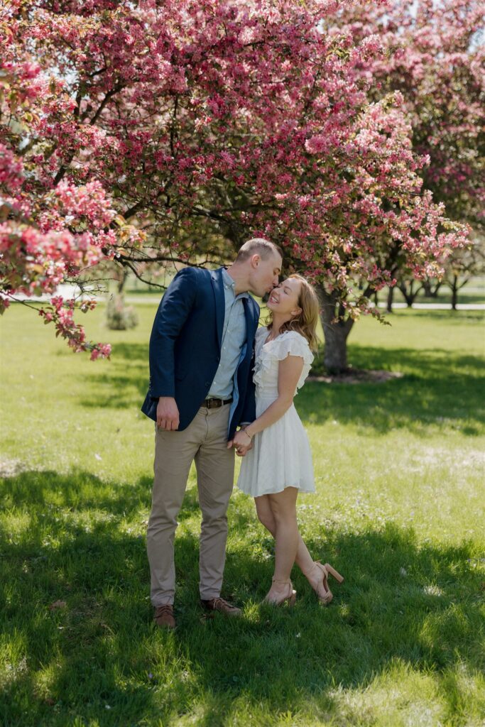fiance kissing his fiance on the cheek