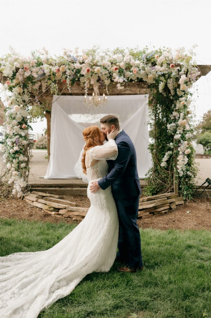 cute portrait of the newlyweds kissing