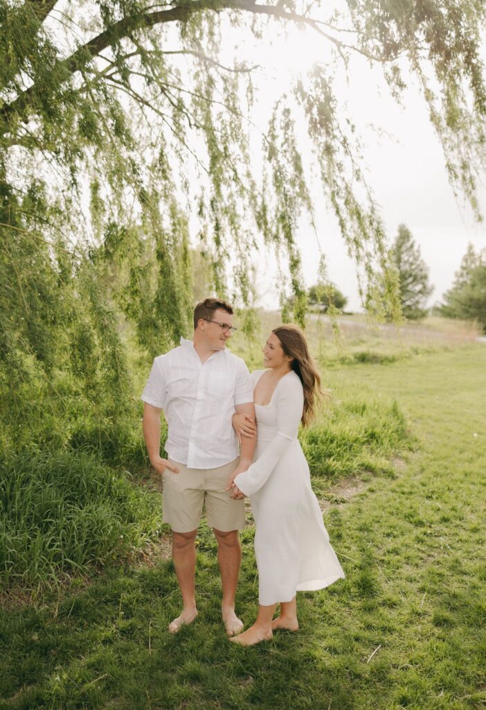 cute picture of the newly engaged couple smiling at each other
