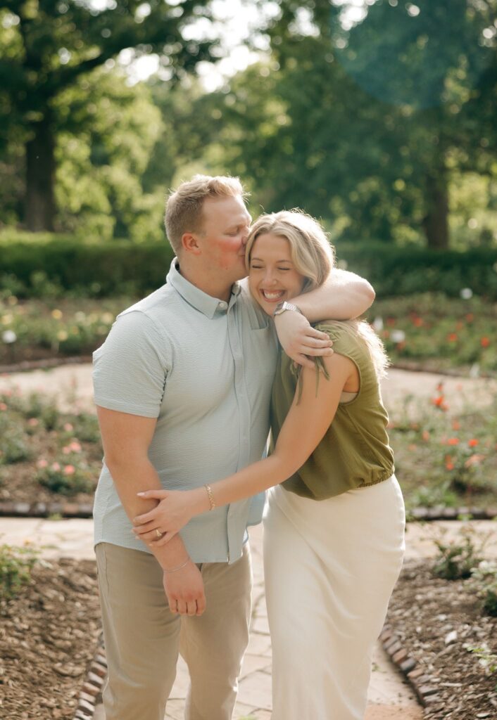 fiance kissing his fiance on the forehead