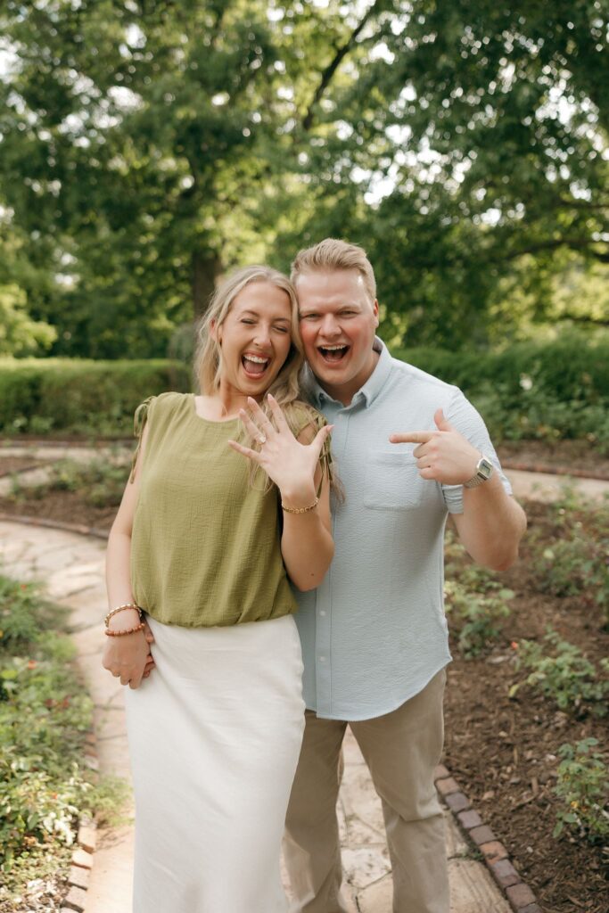 couple smiling at the camera during their photoshoot