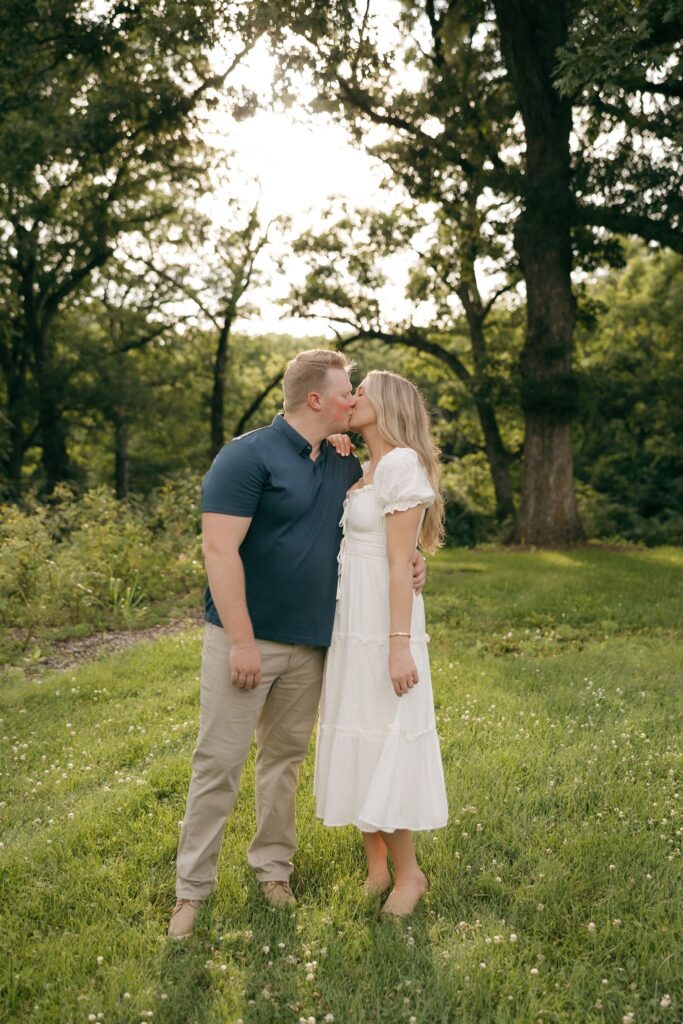 cute picture of the newly engaged couple kissing