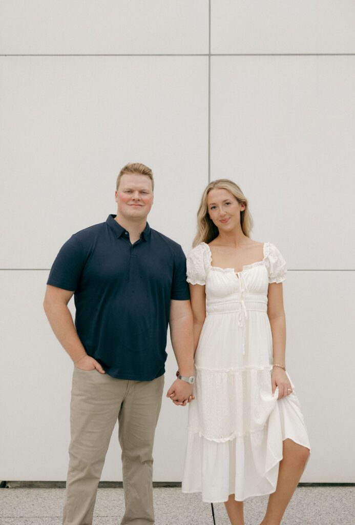 couple smiling at the camera during their photoshoot