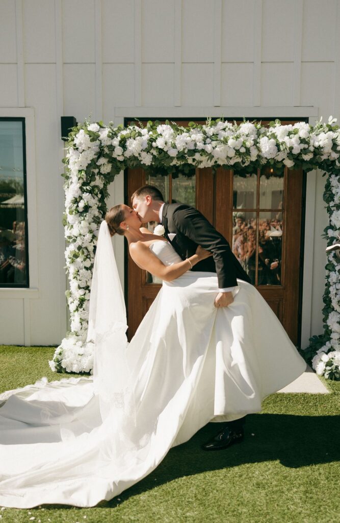 newlyweds kissing after the wedding ceremony