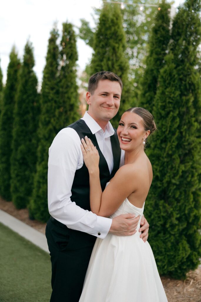 couple smiling at the camera during their photoshoot